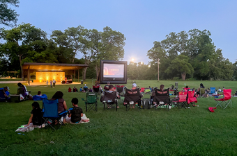 people watching a movie in the park at the Georgetown Parks & Recreation Sunset Movie Series