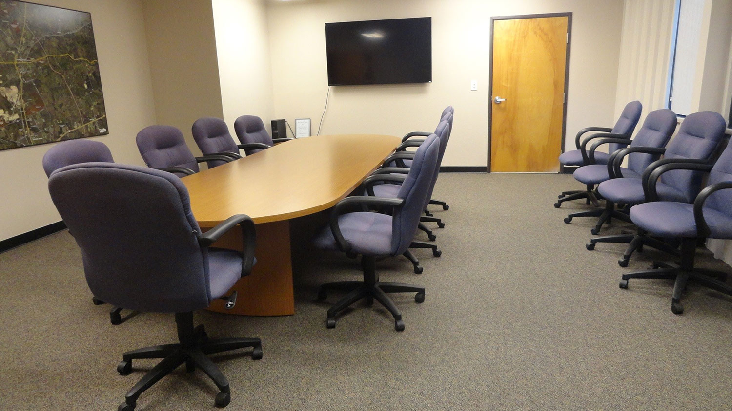 Conference room with conference style table and chairs