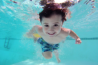 Underwater photo of young boy swimming