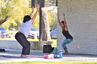 Outdoor yoga class at the Legacy Pavilion in San Gabriel park in Georgetown, tX