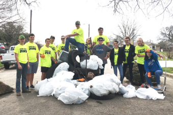 group of volunteers with trash bags